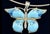 Vintage Alan K signed millefiori Murano glass butterfly pendant set in sterling silver. Dangles from a sterling omega...