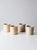 Set of four antique stoneware crocks in softly varied neutral tones, with classic rounded forms and authentic aged...