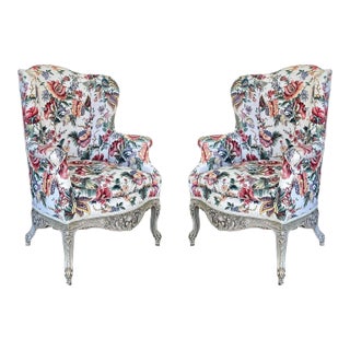 Late 19th Century Finely Carved Louis XV Style Wing Chairs in Floral Linen - a Pair For Sale