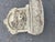 Charming cast stone classical-style table top fountain. The upper backplate features high-relief sculptures of two cherubs...