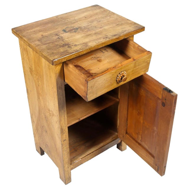This early 20th-century nightstand was produced in Austria. It is made of solid pine.