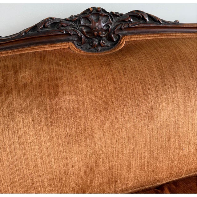 A beautifully carved antique French Louis XV Rococo Revival settee, dating to the late 19th century. The frame is crafted...