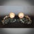 A pair of art deco bookends in the form of two stylised bronze rams rolling boulders of marble up an angled marble plinth....