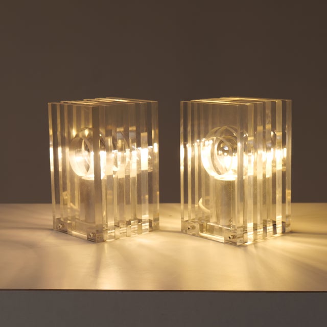 A very rare set of two lamps attributed to Sandro Petti for Maison Jansen. The exceptional quality of craftsmanship and...