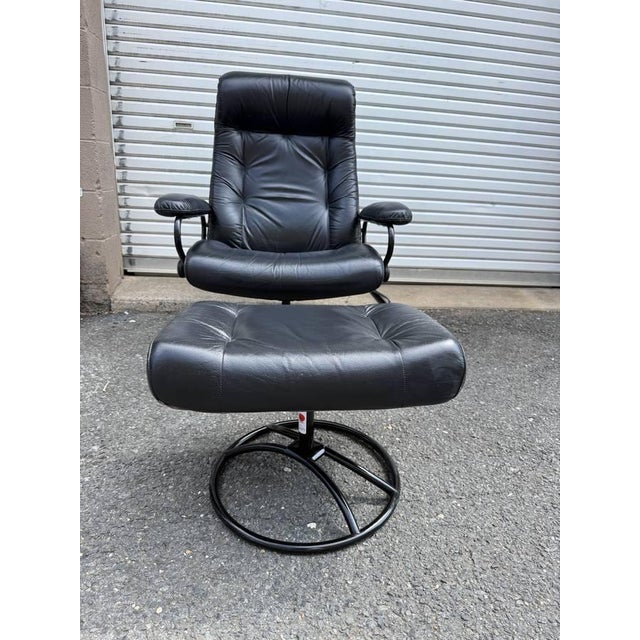 Vintage Ekornes Stressless Black Leather Recliner & Ottoman It features swiveling chrome base . This chair is adjustable...