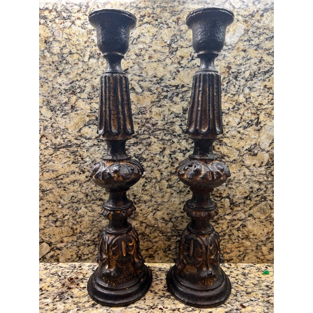 Beautiful dark brown candleholders from the Kreiss Collection. Very decorative style. Height 19 inches width 4 inches....