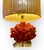 Enjoy elegance with this luxurious Caribbean Fire Coral table lamp. Featuring a lucite base and a hand woven natural...