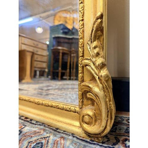 A striking pair of tall, narrow french rococo–inspired mirrors in the louis xvi style. Crafted from gilt wood and plaster,...