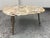 Design Plus Gallery presents the Denham Coffee Table from Made Goods. The Denham coffee table's pebble-shaped top is made...