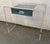 Add a sleek, retro-modern touch to your space with this stunning Lucite waterfall vanity desk. Crafted from thick, high-...