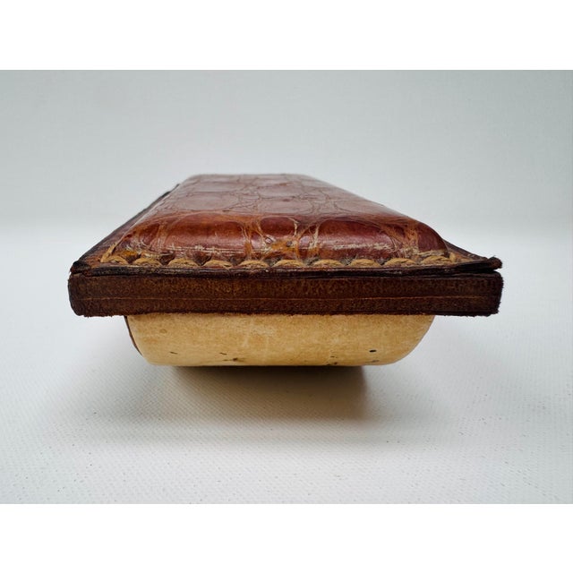 A beautifully aged vintage desk ink blotter crafted in Argentina and wrapped in genuine crocodilian leather, believed to...
