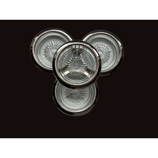 A classic Sheridan silverplated coaster set. 4 coasters never used and in original box.