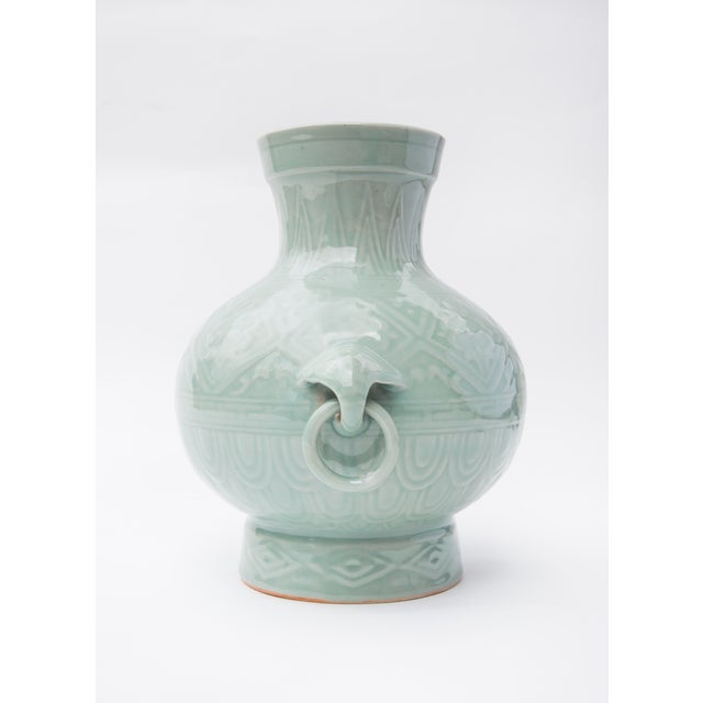 Wondefully ornate Chinese porcelain vase with elephant ring pull detail, finished in a celadon glaze. 1960's vintage and...