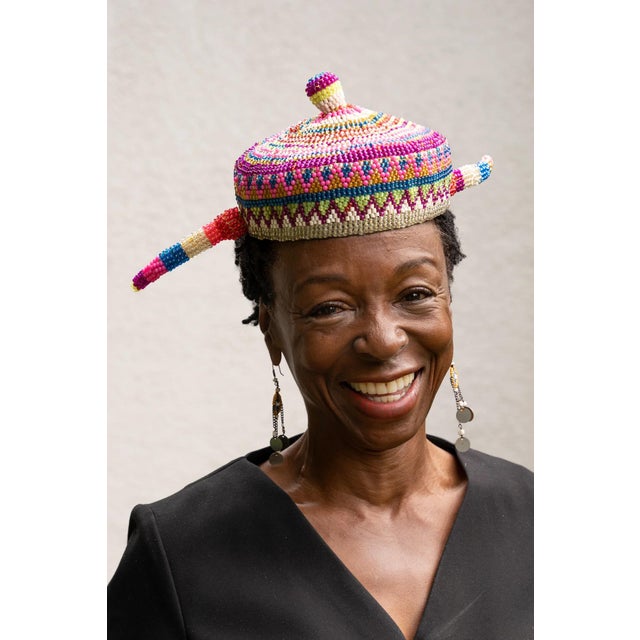 This is a specific type of headdress called a "misango mapende" worn by the Pende people. The Pende tribe is a Bantu-...