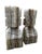 Pair of Brutalist style carved stone sculptures fashioned from onyx, showcasing the natural striations of the stone in...
