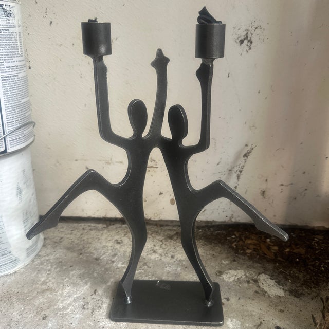 Postmodern figural candleholder in the manner of Ivan Mclean. Heavy and sizable.