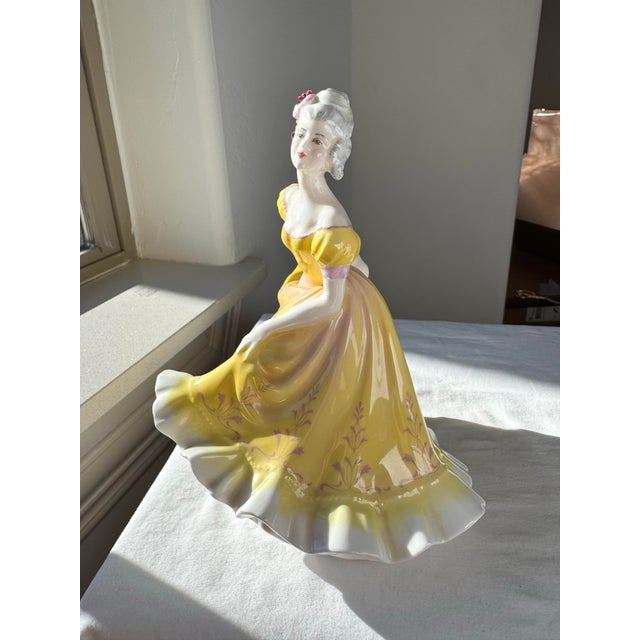“Ninette” (H.N. 2379), introduced by Royal Doulton in 1960, is a finely modeled bone china figurine from the H.N. series....