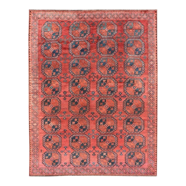 Early 20th Century Hand-Knotted Turkomen Ersari Rug in Wool With Gul Design in Red, Orange and Blue For Sale