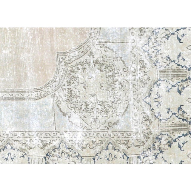 This Vintage Persian Kerman Rug, handcrafted in the Kerman region of Iran, has been expertly distressed and refinished in...