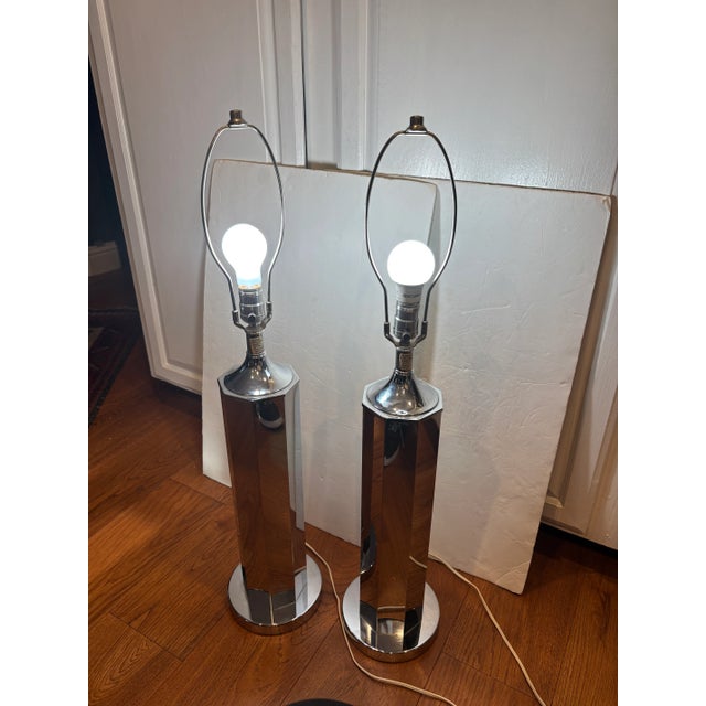 Rare Chrome table lamps circa 1970’s in the style of Sonneman Lighting. The chrome body is suggestive of a pencil in form,...