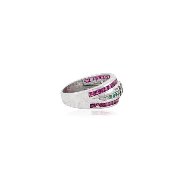 This unique 2.23 carat ruby & emerald dome band ring for women is crafted in 925 sterling silver. Featuring round and...
