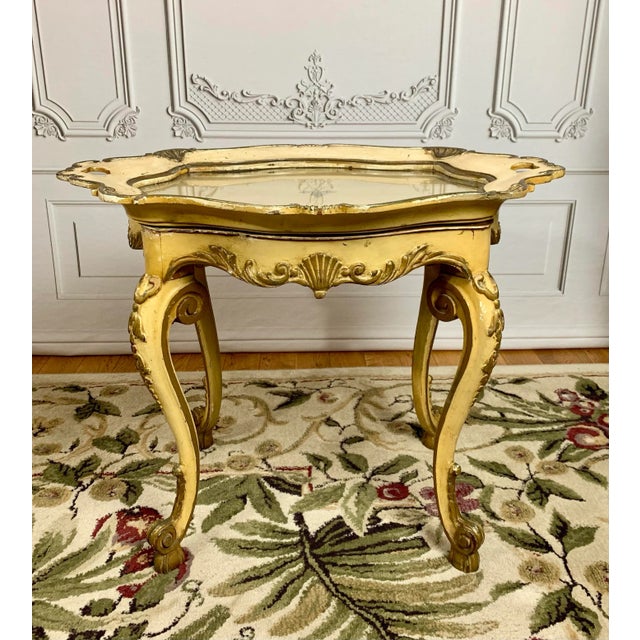 Made in France circa late 18th century. A lavishly decorated Rococo style lightweight accent table purposefully designed...