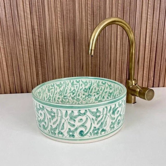 1) Experience the unparalleled beauty of our Flower Ceramic Sink Bowl, expertly crafted by skilled Moroccan artisans. This...