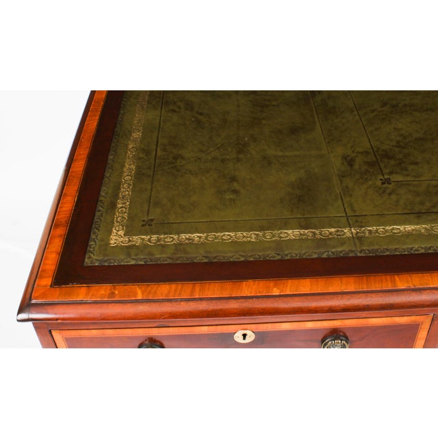 This is a beautiful antique Victorian flame mahogany and satinwood crossbanded pedestal partners desk, circa 1860 in date....