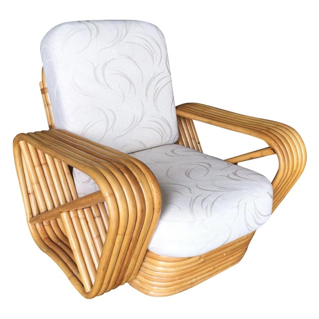 Paul Frankl style Rattan living-room set including a matching sectional sofa and lounge chair. Both feature the famous six...