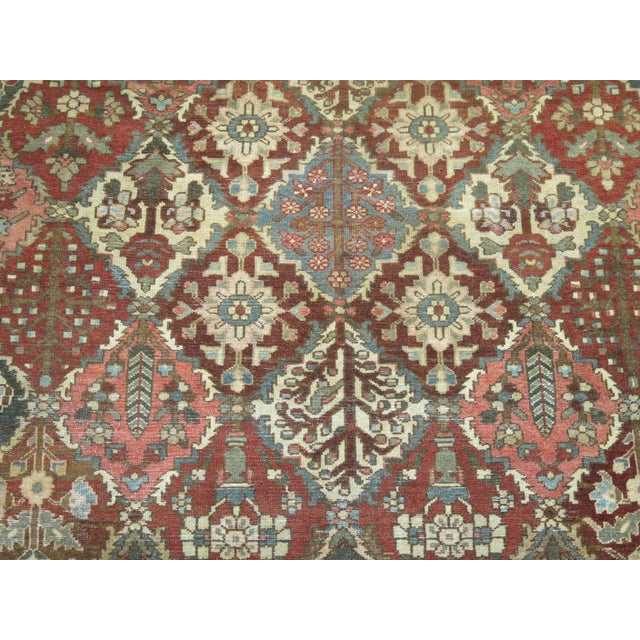 Square size all over design geometric Persian Bakhtiari rug in rustic tones, circa 1920, measures: 10'3" x 10'4".