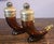 This is a good pair of vintage 1960s brown glass Avon after shave bottles in the shape of Viking Horns. Brass or gold...