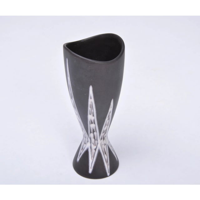 This stylish mid-century ceramic vase was designed in Denmark and is part of the "Burgundia" series designed by Holm...