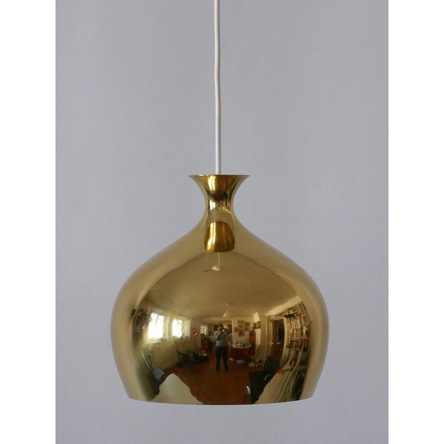 Organic shaped, elegant and highly decorative mid-century modern solid brass pendant lamp or hanging light 'löken' or...