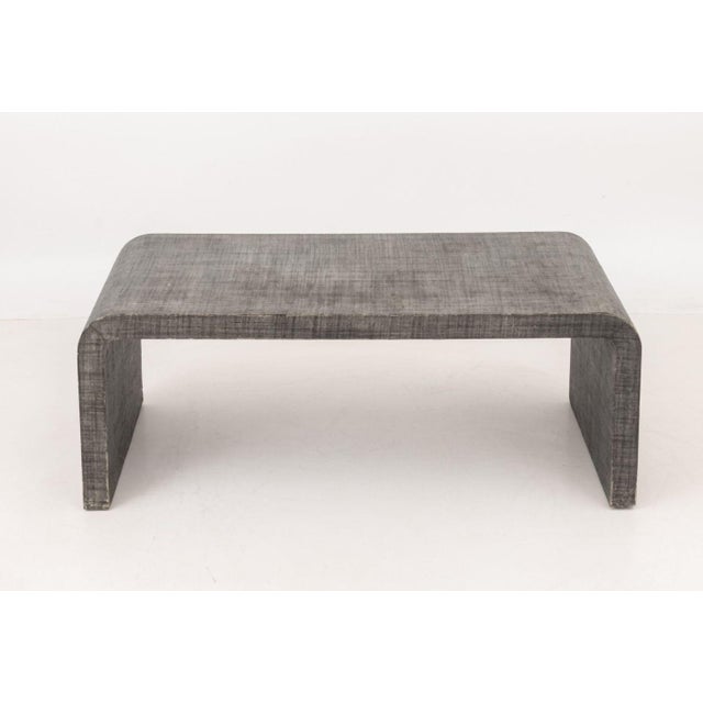 Karl Springer Style Gray Grasscloth Waterfall Coffee Table. 18" H x 48" W x 26" D. Provenance: From a New York City...