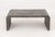 Karl Springer Style Gray Grasscloth Waterfall Coffee Table. 18" H x 48" W x 26" D. Provenance: From a New York City...