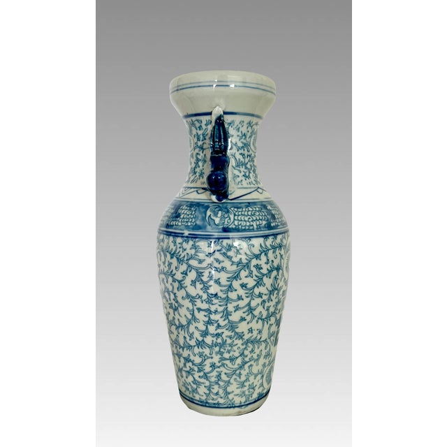 Vintage Chinese Double Happiness porcelain vase with a pair of royal blue auspicious foo / fu lions on either side that...