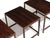 Set of three Danish Modern nesting tables c 1955, Denmark. Finely handcrafted of richly figured Brazilian rosewood with...