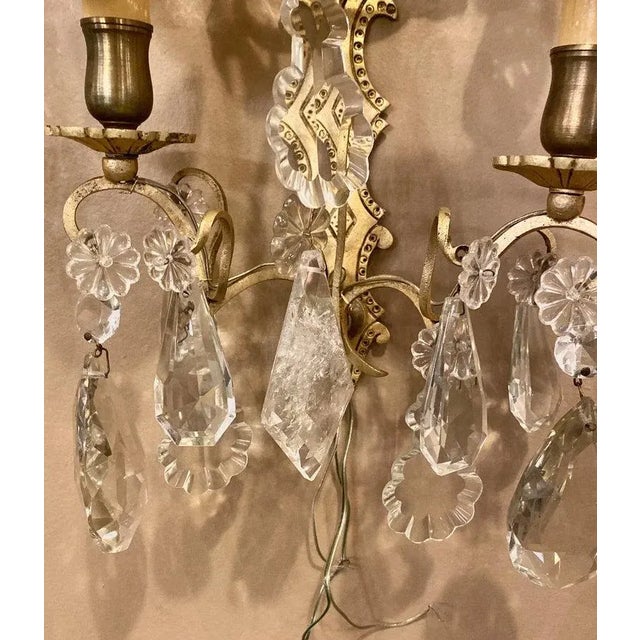 Pair of two light covered mixed crystal and rock crystal bronze wall sconces each having matching shield shade covers with...