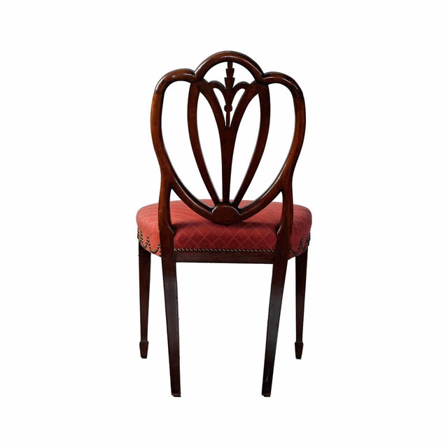 Pair of antique, Hepplewhite style shield back chairs. Custom upholstered with brass tack design.