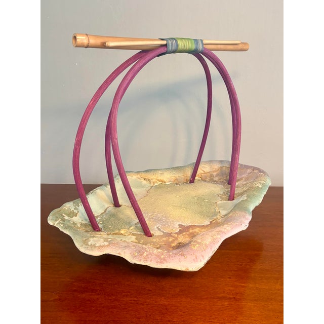 This sculptural ceramic basket by Tony Evans exemplifies the artist’s inventive approach to form and material. Constructed...