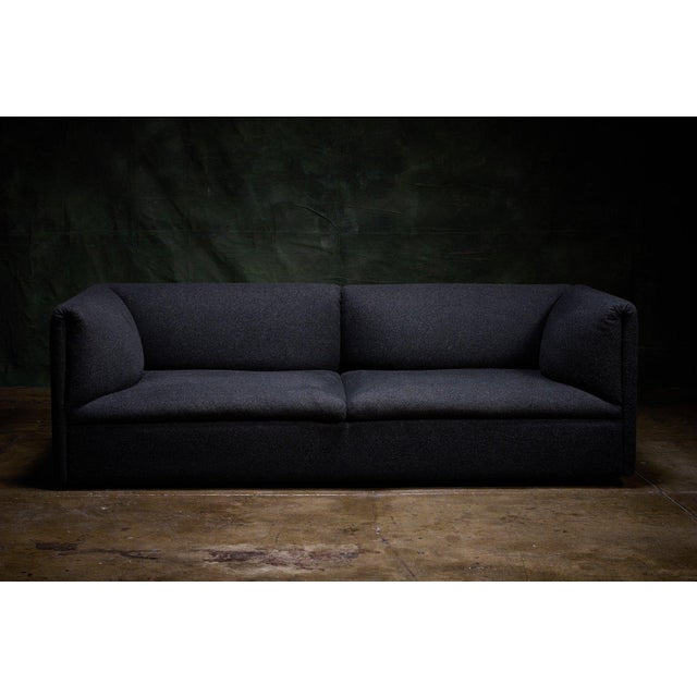 Fogia contemporary 'Retreat' sofa in dark gray. The rounded-arm silhouette and factory-sewn upholstery give it a clean...