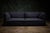 Fogia contemporary 'Retreat' sofa in dark gray. The rounded-arm silhouette and factory-sewn upholstery give it a clean...