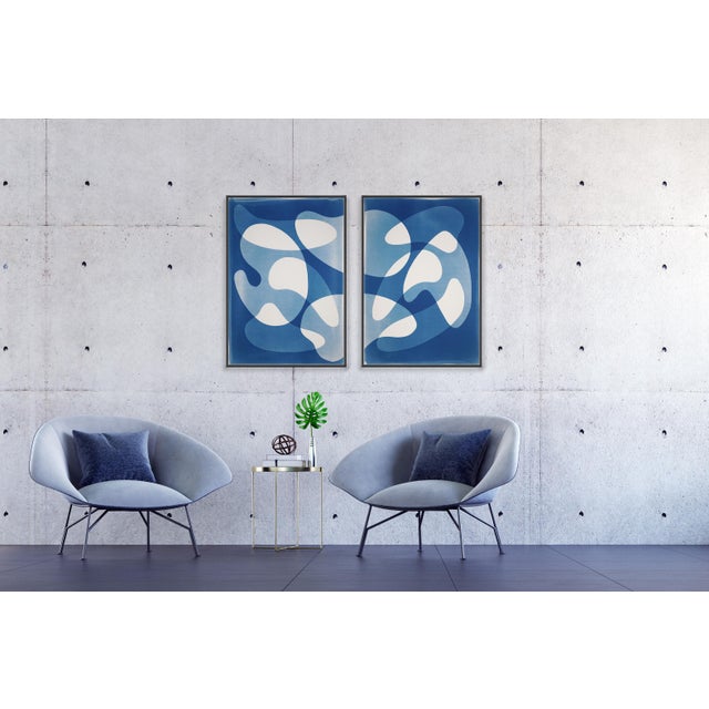"Retro Overlaps II" is a unique handmade cyanotype on watercolor paper, presented as a striking abstract triptych. The...