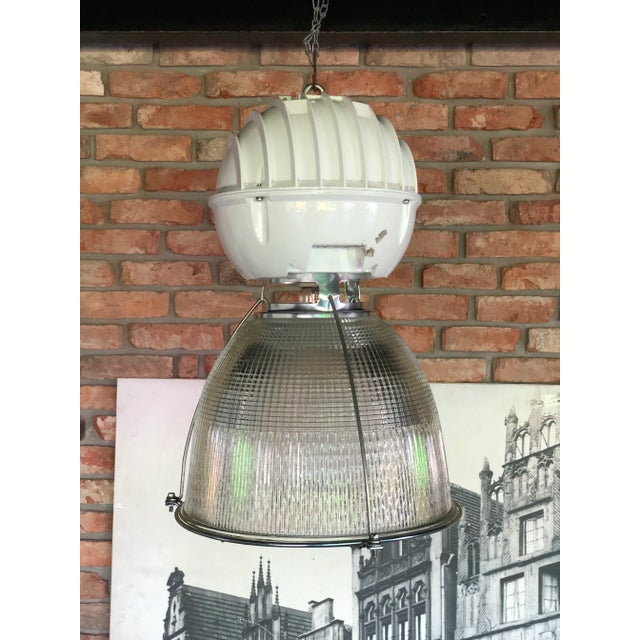 - Made by Holophane in England in the 1980s - The prismatic glass intensifies and casts the light evenly all around the...