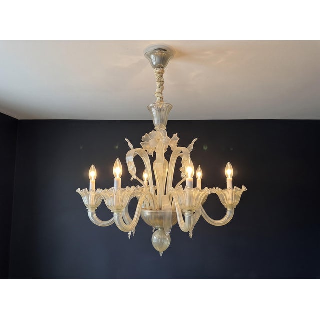 A mid century modern Italian six light chandelier made of hand blown Murano Venetian opal glass. Made in Italy. Circa...