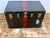 Design Plus Gallery presents an Antique Steamer Trunk in Black with Red Accents + Antique Brass Hardware. This steamer is...