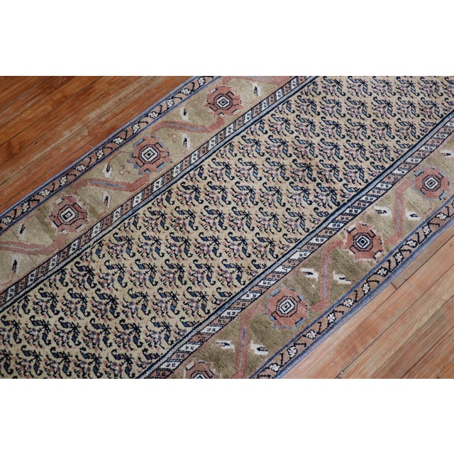 A one of a kind Northwest Persian runner with a repetitive geometric design in navy and camel accents. Measures: 2'11" x...