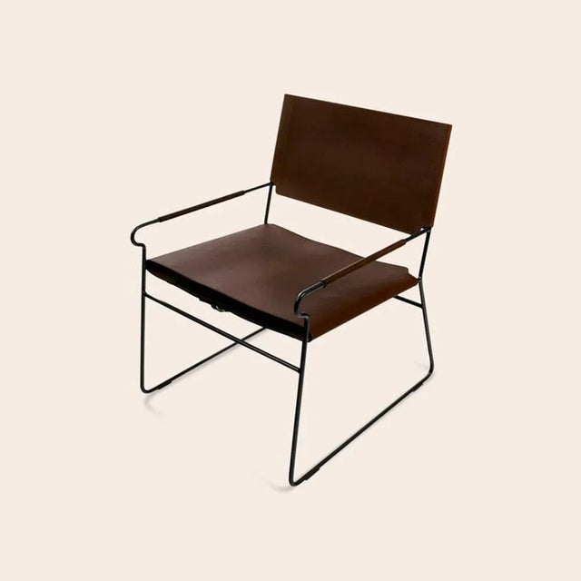Mocca Next Rest Chair by OxDenmarq Dimensions: D 66 x W 60 x H 77 cm Materials: Leather, Black Powder Coated Steel