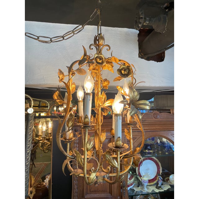 Vintage 1960s Italian Mid Century Hollywood Regency Gilt Floral and Fauna Six Light Chandelier. Beautiful styling and...