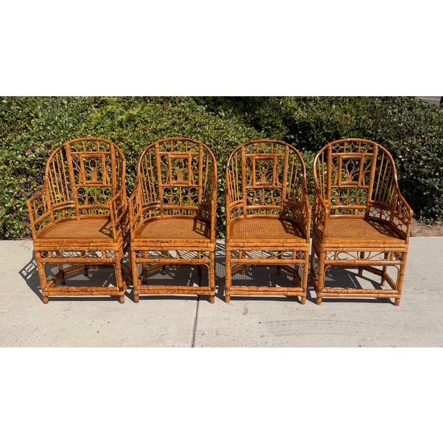 Set of 4 gorgeous Brighton Pavilion style chairs! These 6 legged vintage gems are constructed of bentwood rattan and...